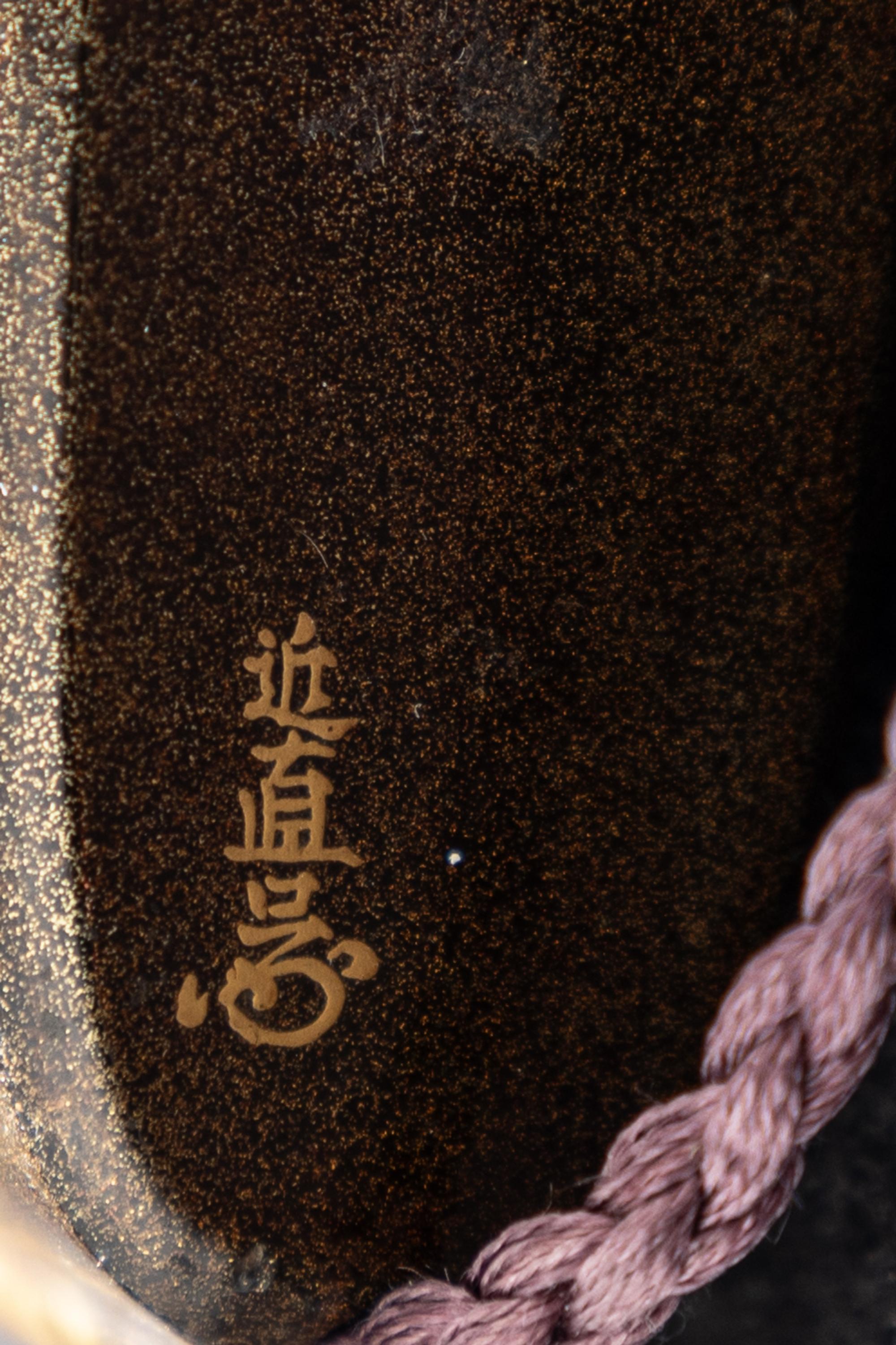 A Japanese Gold and Black Lacquer Three-Case Inro