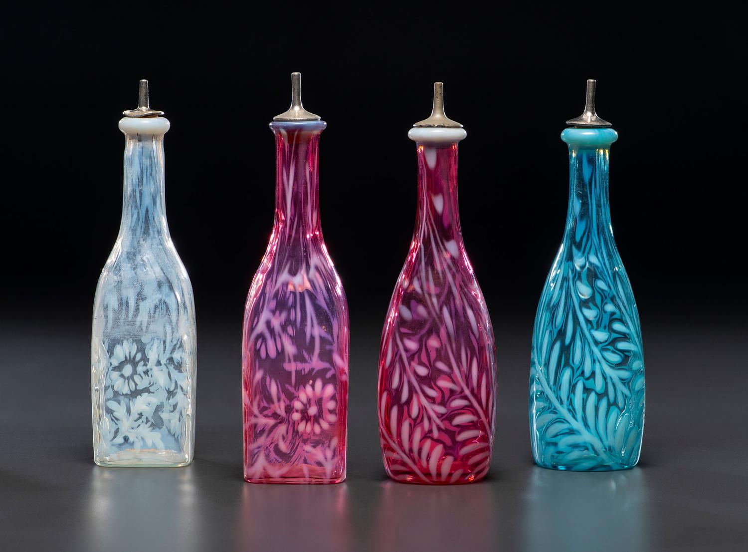 Four Fern Opalescent Glass Barber's Bottles