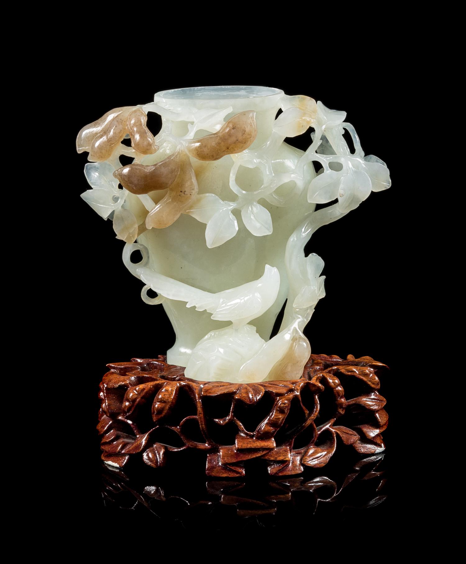 A Chinese White and Russet Jade Vase