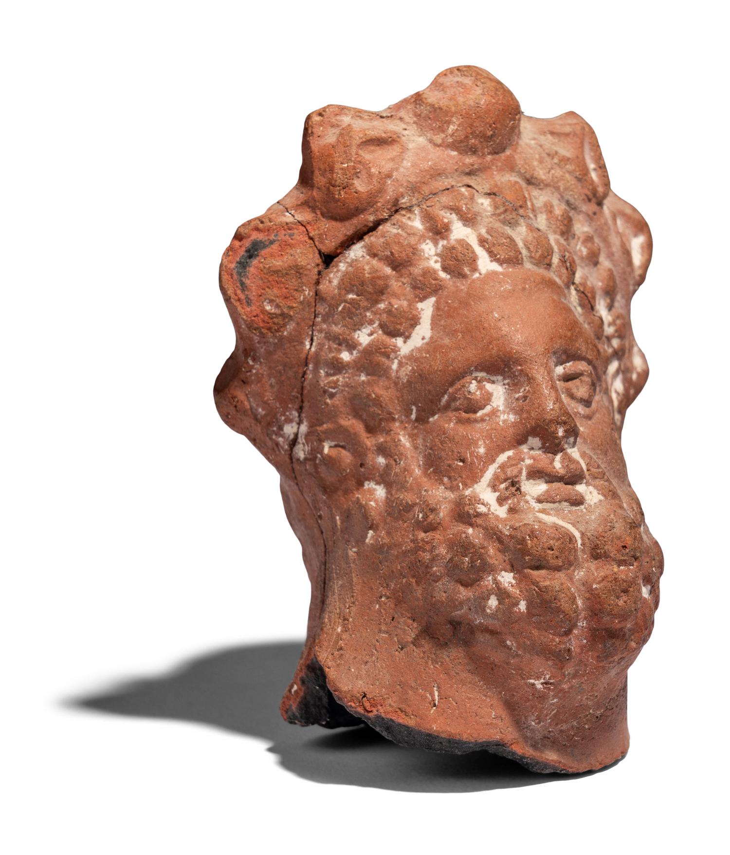 An Egyptian Terracotta Head of Serapis