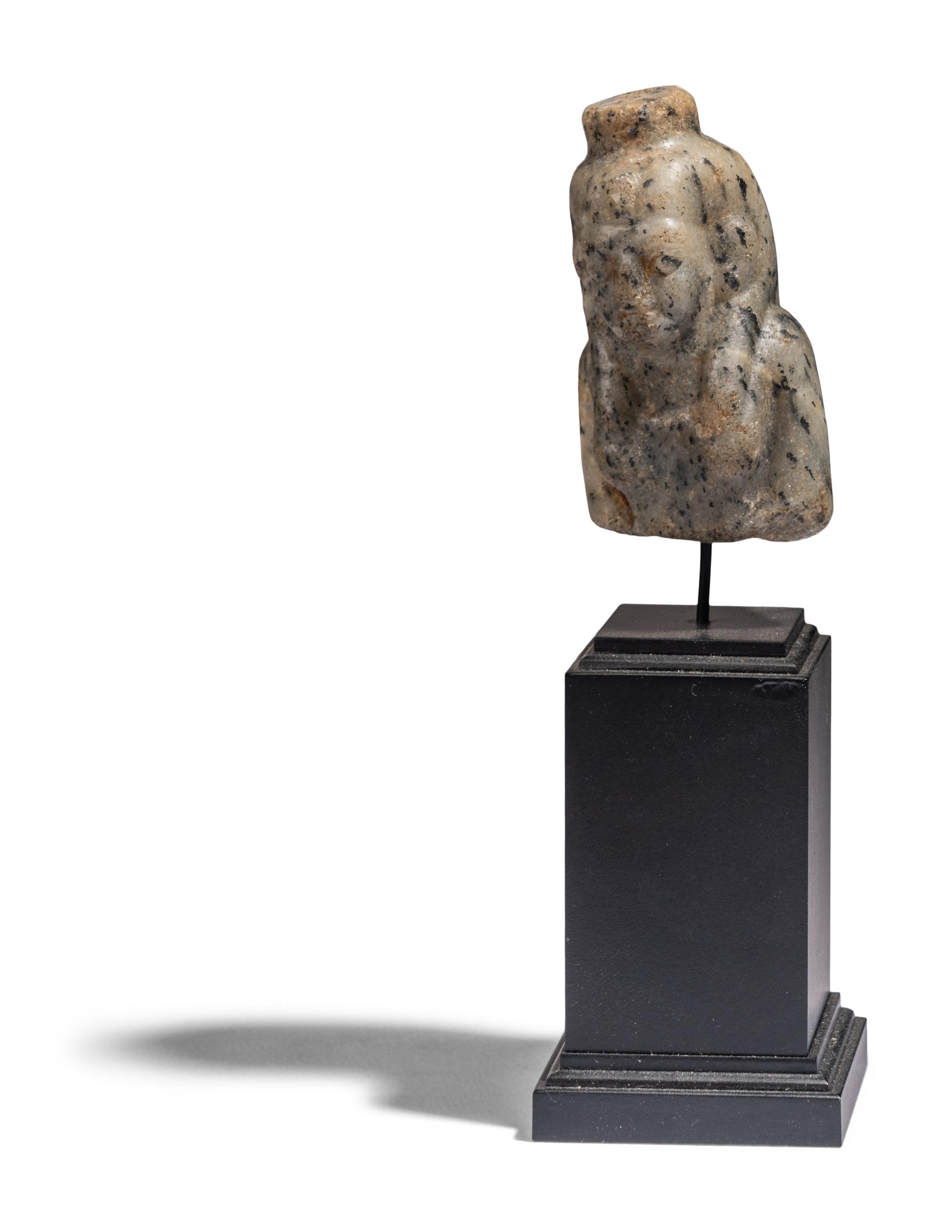 An Egyptian Stone Bust of Hathor