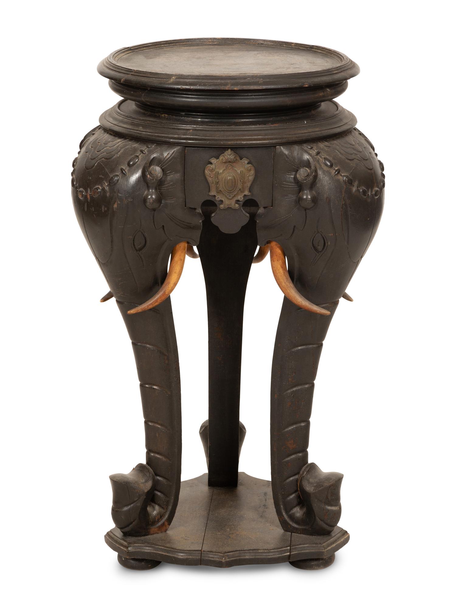 An Anglo-Indian Carved Ebonized Elephant Table