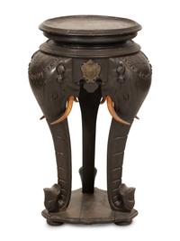 An Anglo-Indian Carved Ebonized Elephant Table