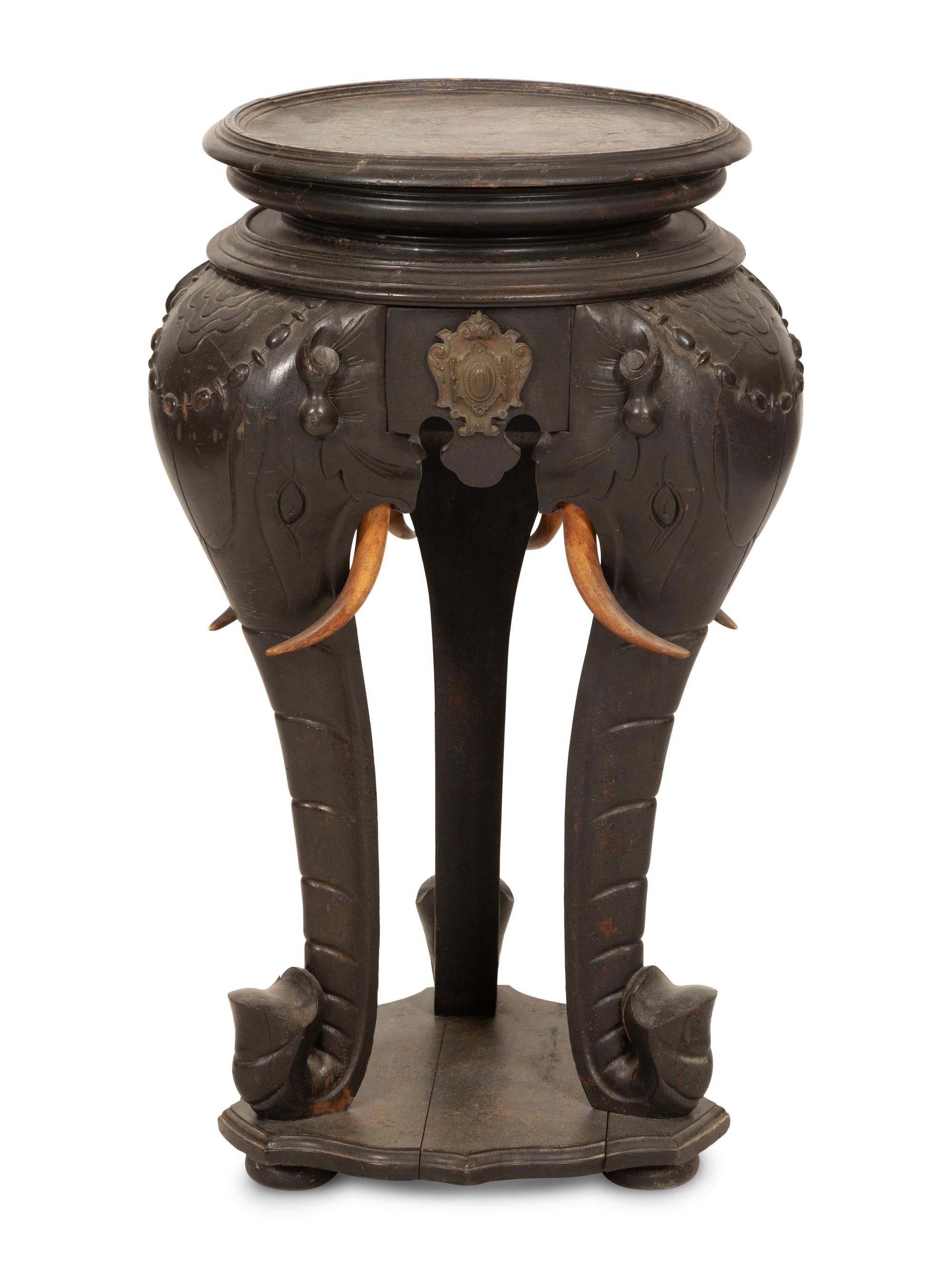 An Anglo-Indian Carved Ebonized Elephant Table
