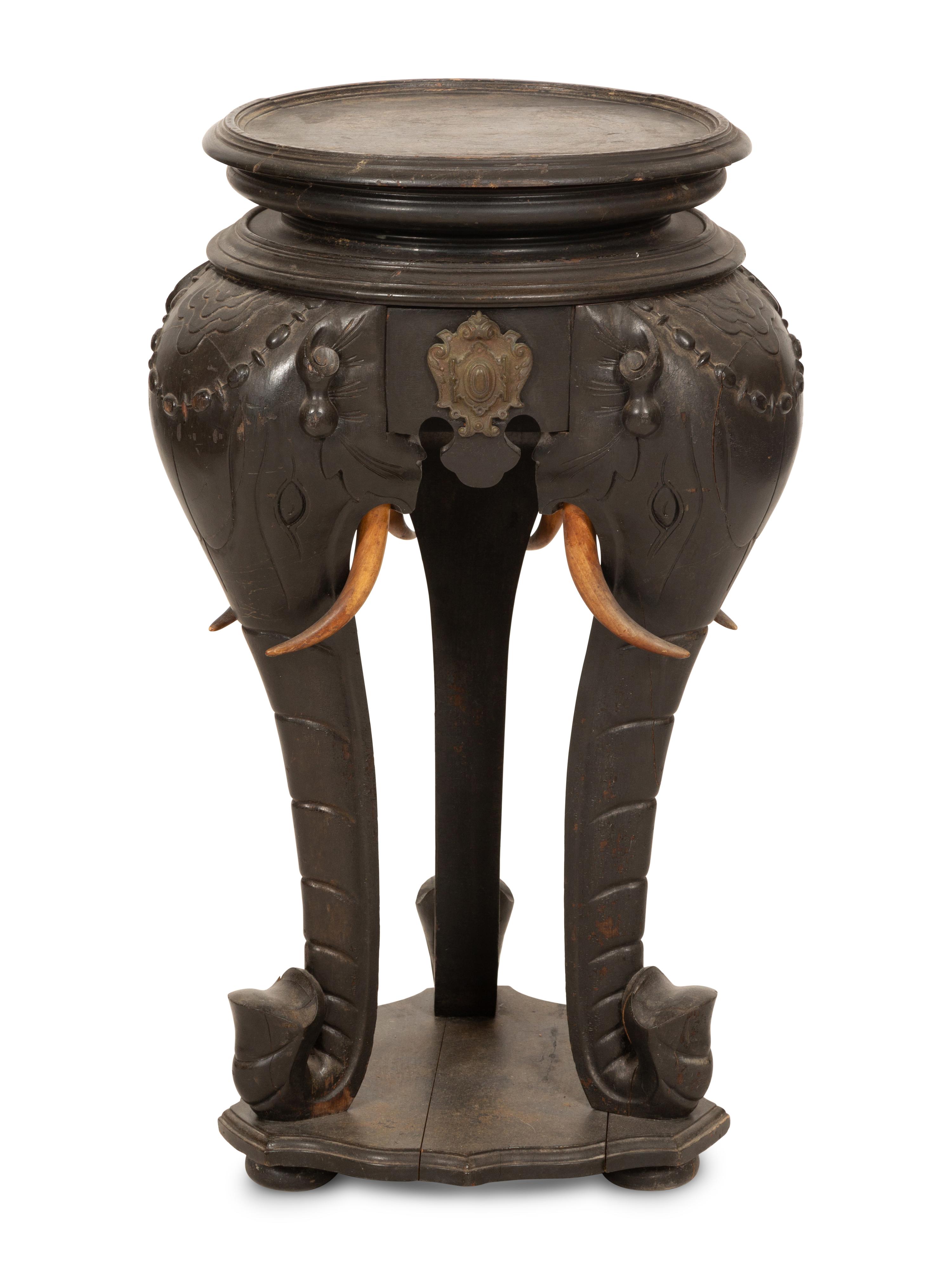 An Anglo-Indian Carved Ebonized Elephant Table