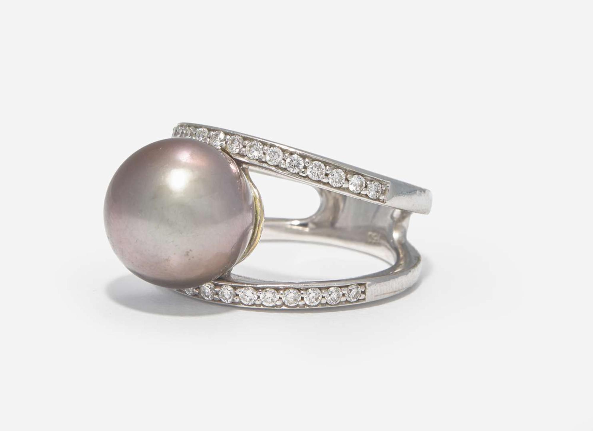 An 18K White Gold, Diamond, and Pearl Bracelet and Ring