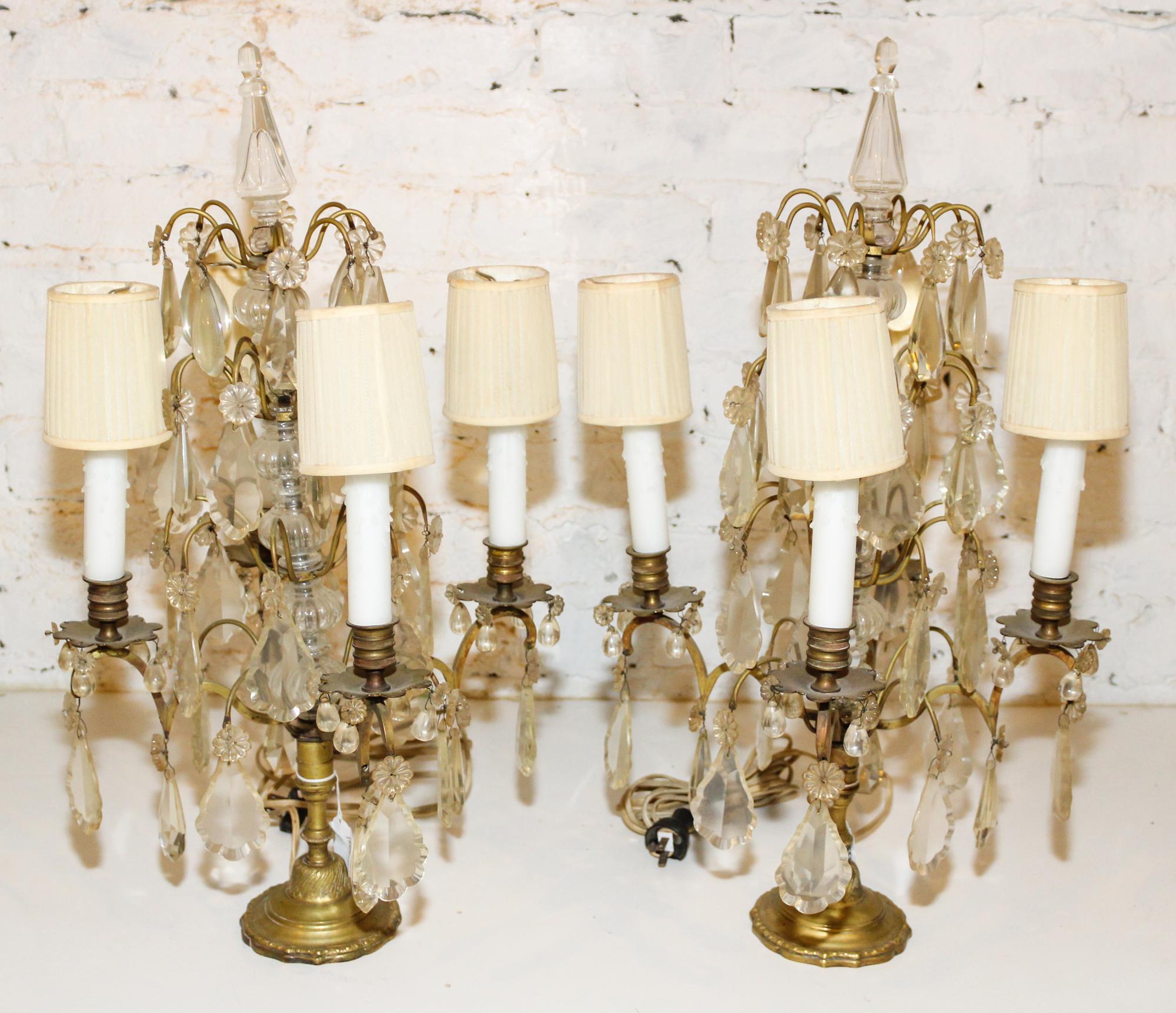 A Pair of Brass and Glass Four Light Candelabra. Height 23 inches.