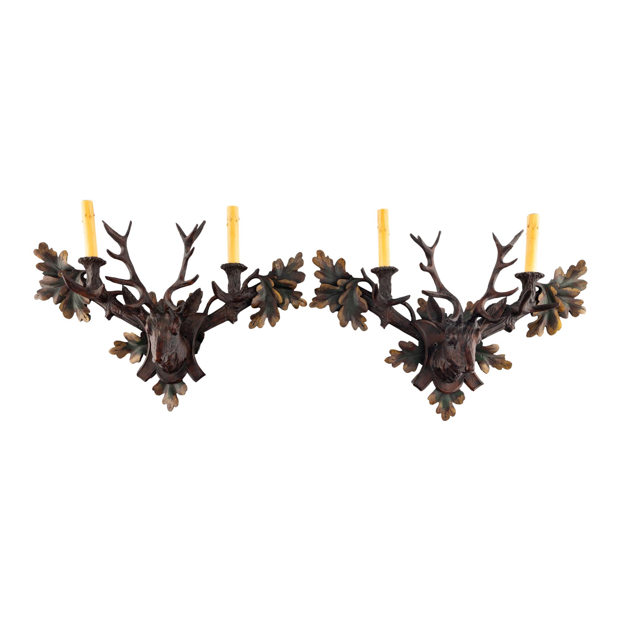 A Pair of Black-Forest Style Polychrome Decorated Two-Light Sconces