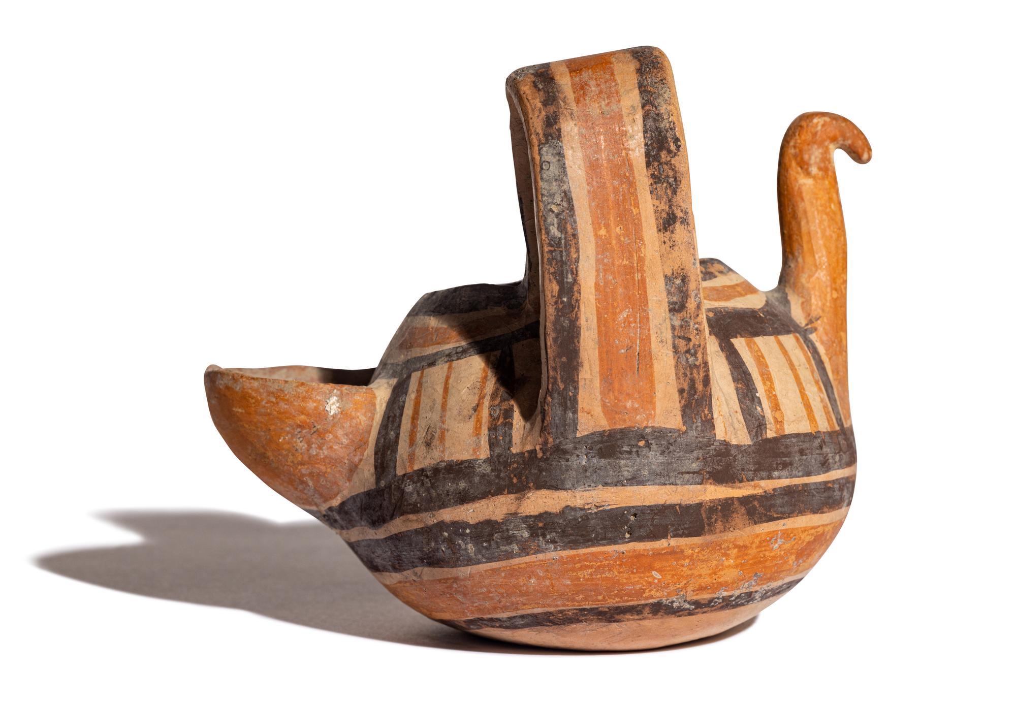 A Daunian Painted Pottery Figural Vessel in the Form of a Bird