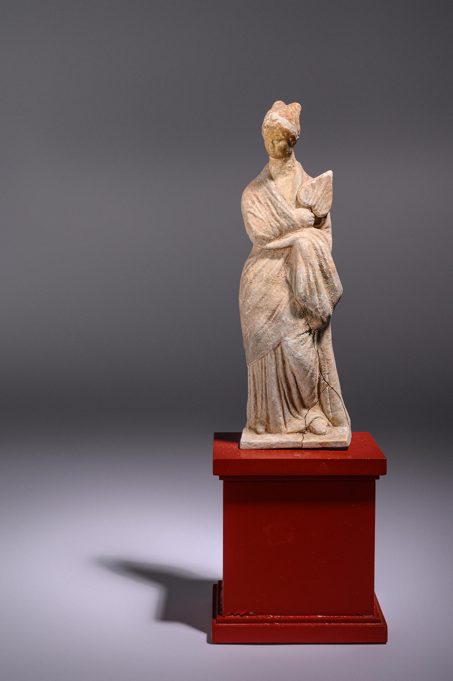 A Greek Terracotta Female with a Fan
