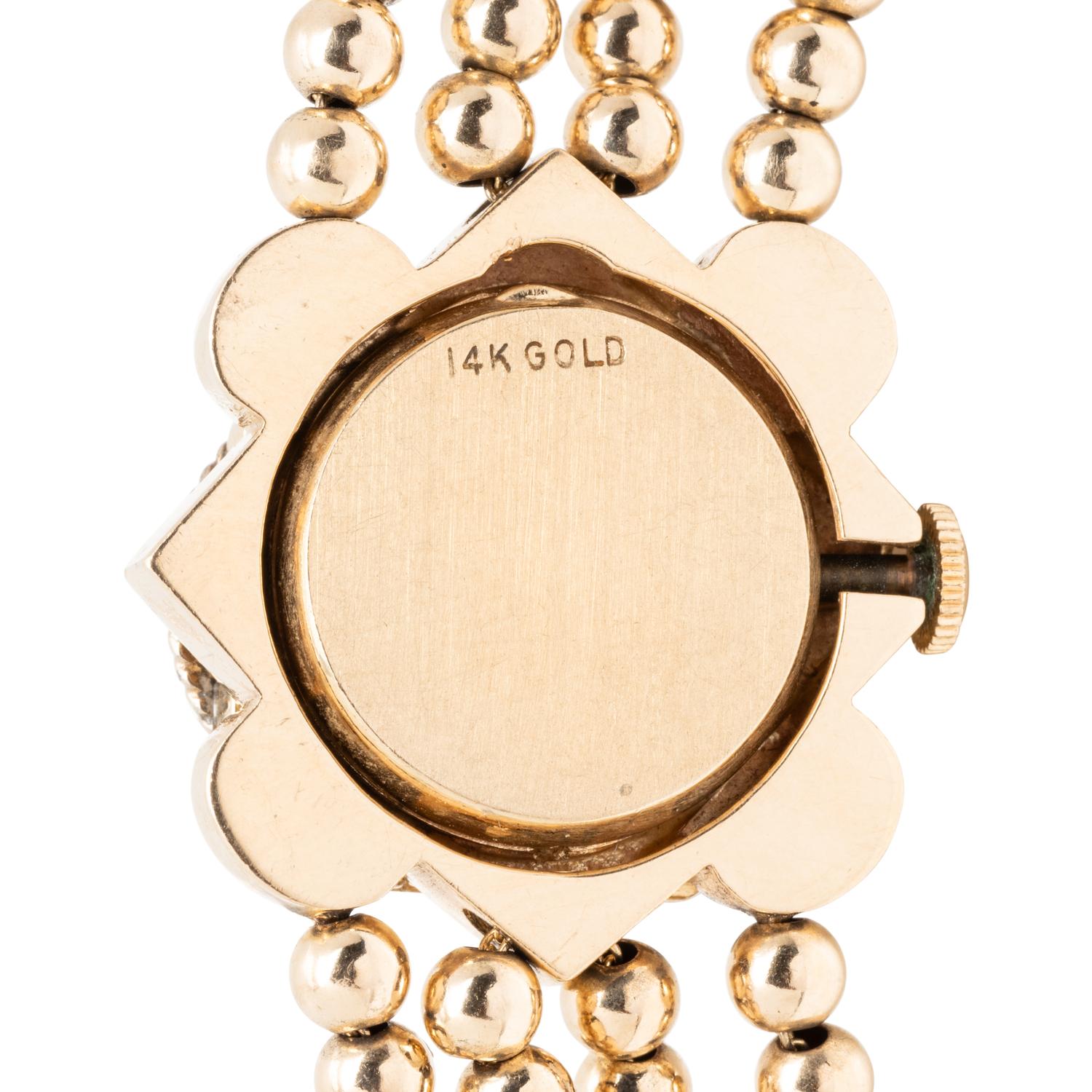 YELLOW GOLD AND MULTIGEM SURPRISE WATCH