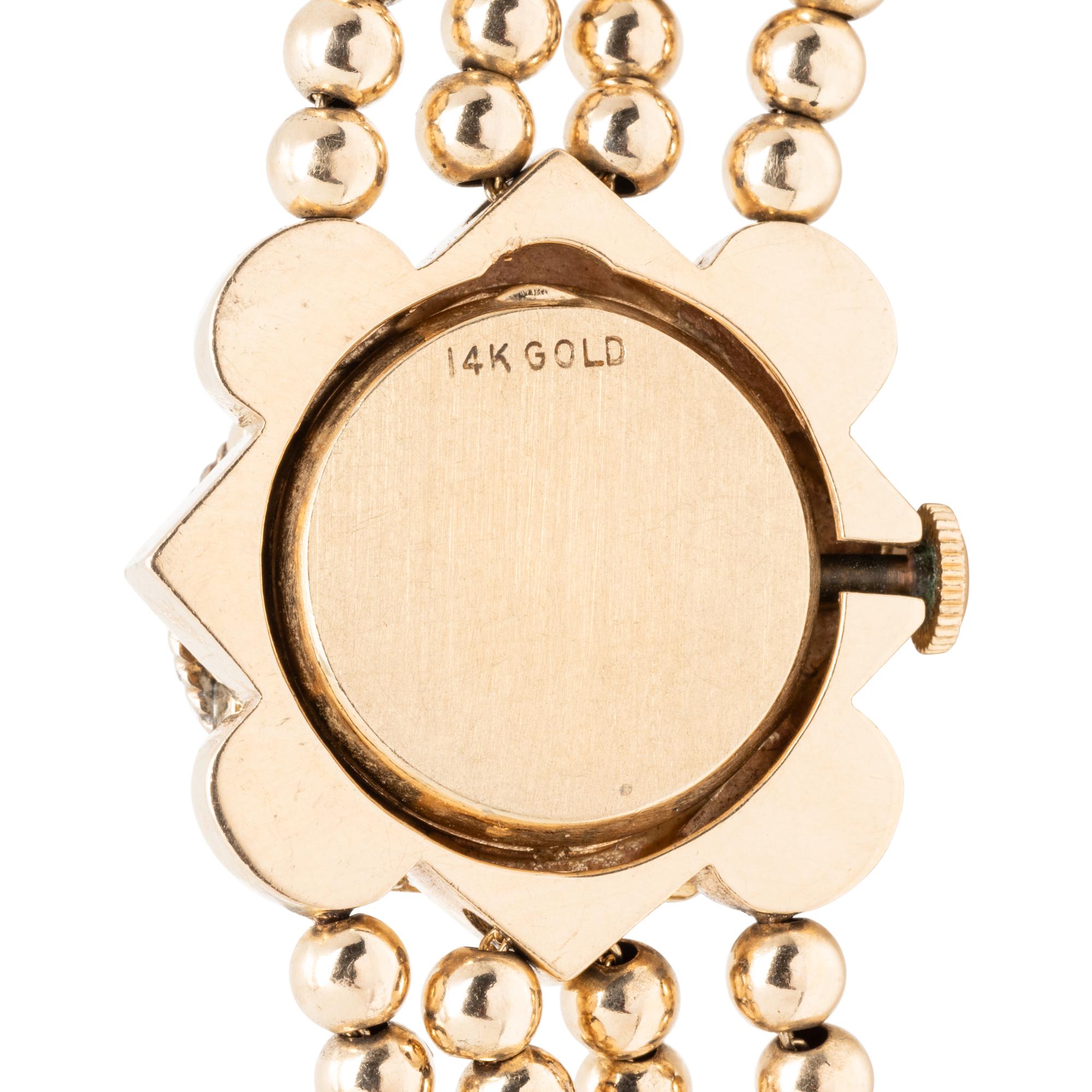 YELLOW GOLD AND MULTIGEM SURPRISE WATCH