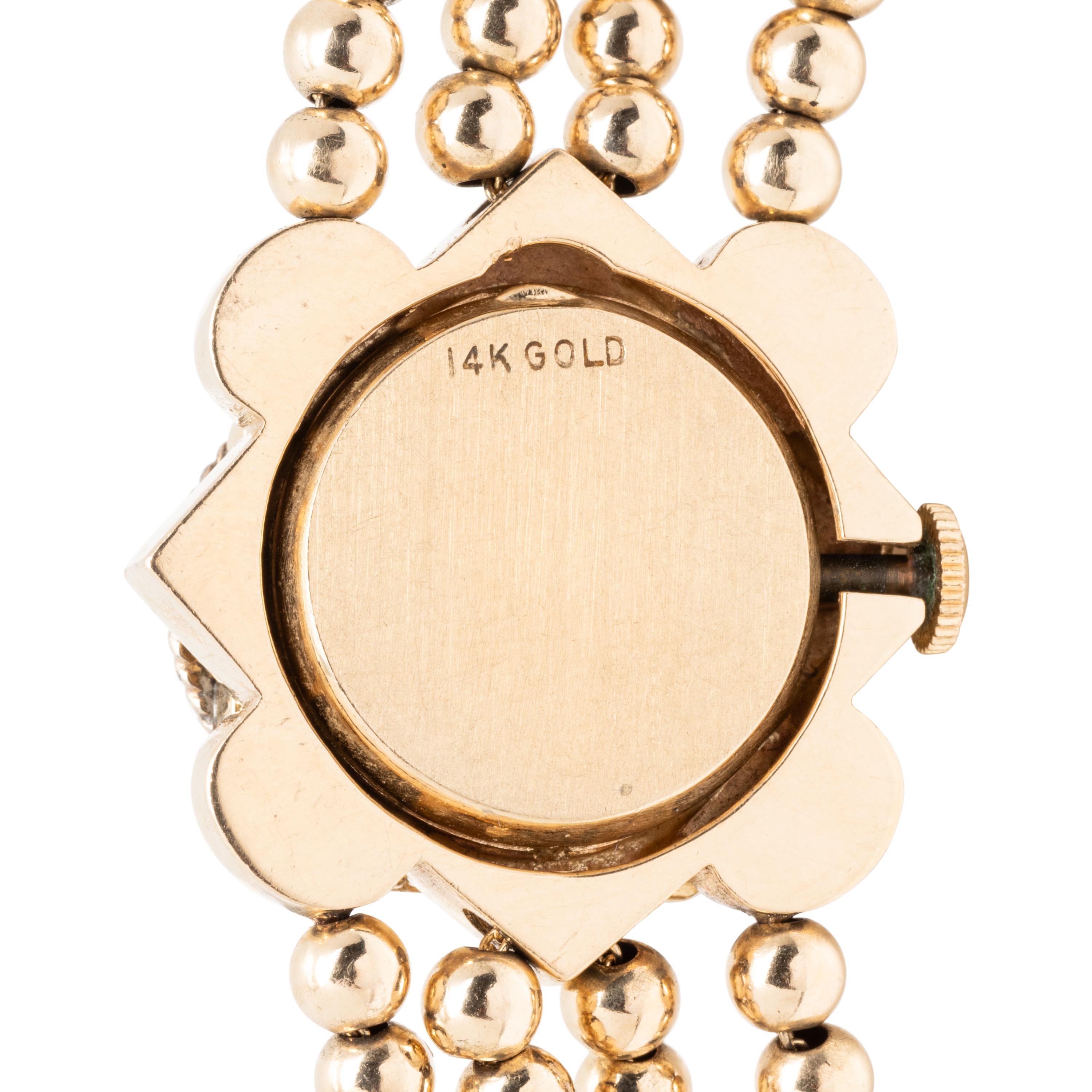 YELLOW GOLD AND MULTIGEM SURPRISE WATCH