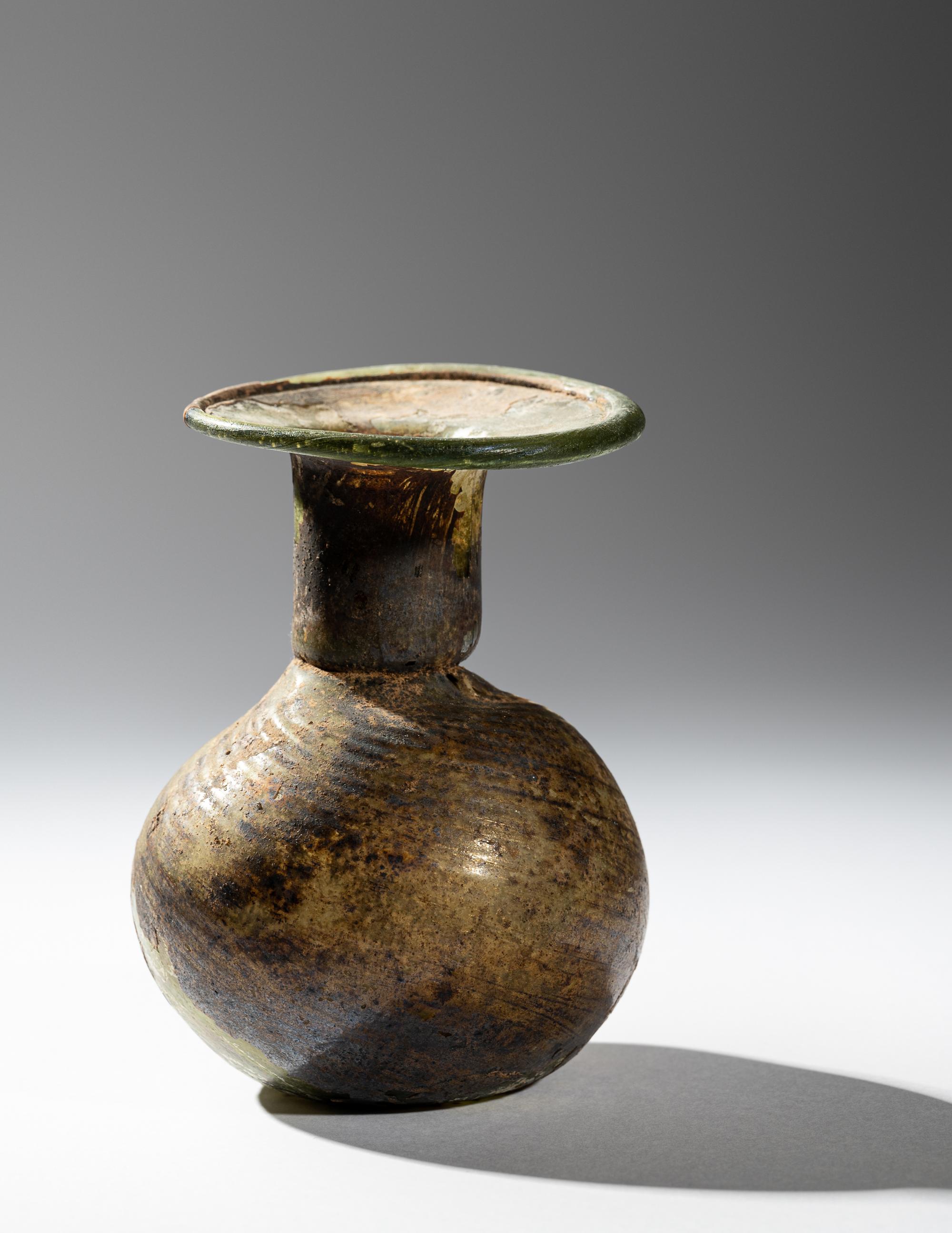 A Roman Green Glass Bottle