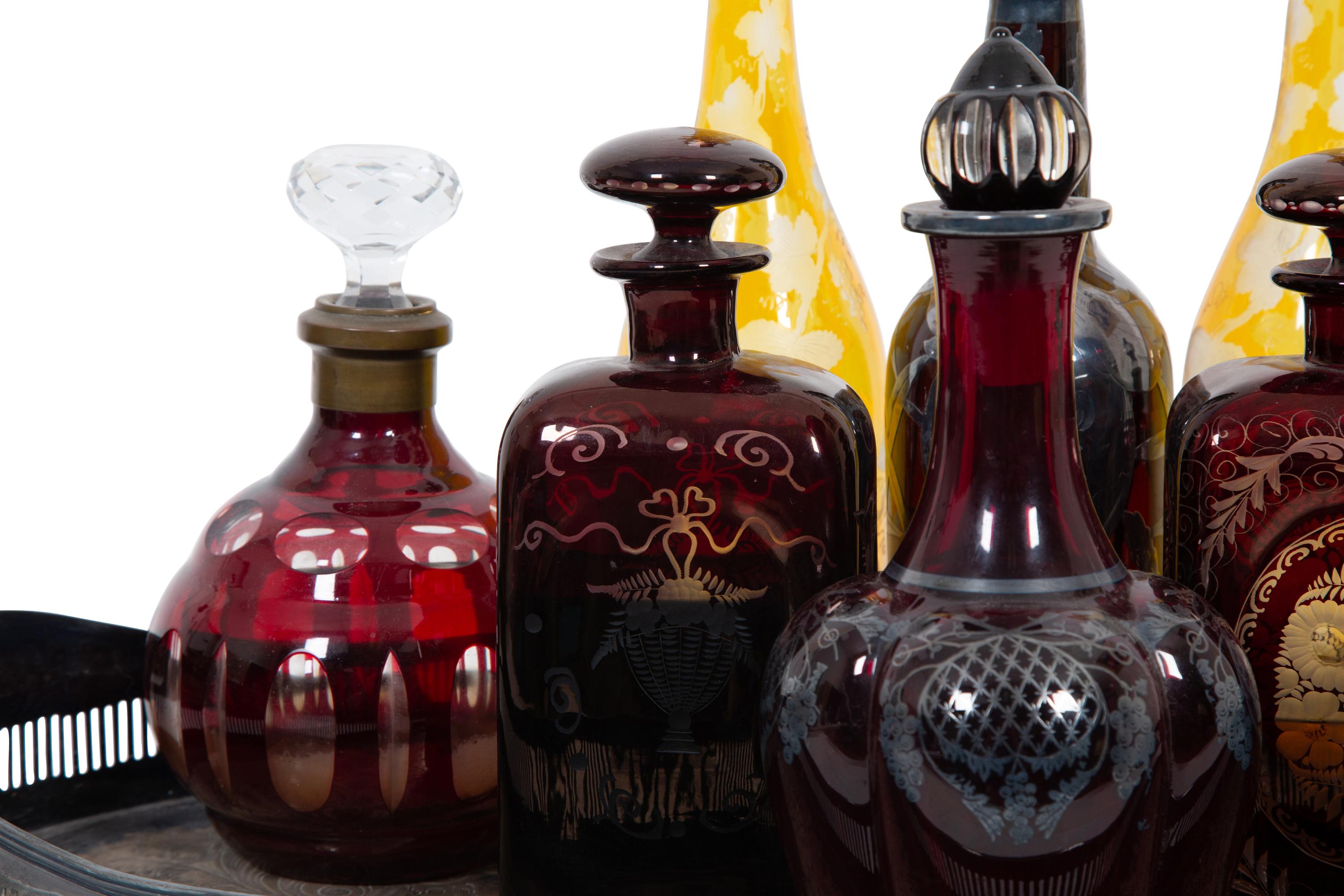 Eight Colored Glass Decanters and a Silver-Plate Galleried Serving Tray