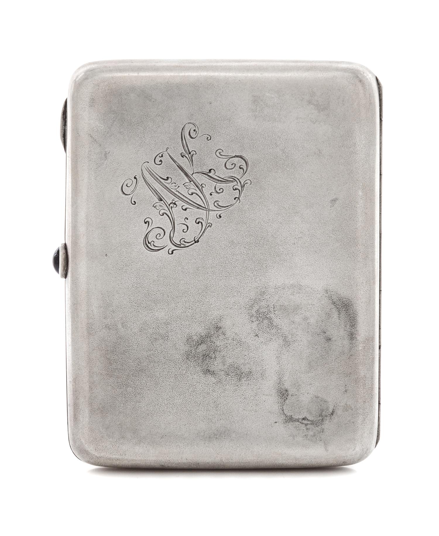 A Russian Silver Cigarette Case, Mark of the Fourth Jeweler's Artel, St. Petersburg, early 20th century, the lid with raised decoration