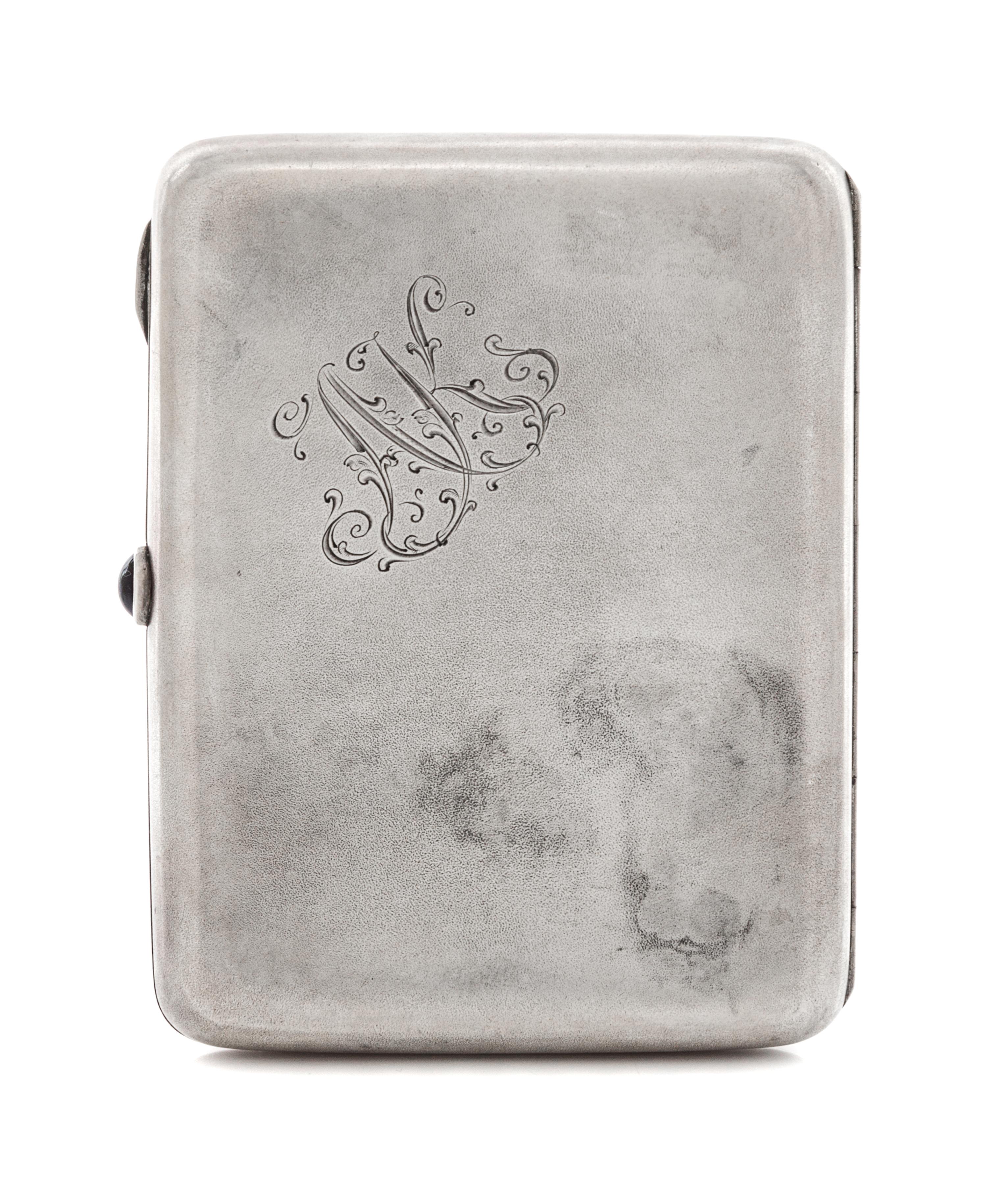 A Russian Silver Cigarette Case, Mark of the Fourth Jeweler's Artel, St. Petersburg, early 20th century, the lid with raised decoration