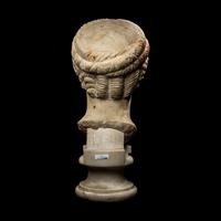 A Roman Marble Archaistic Head of a Goddess