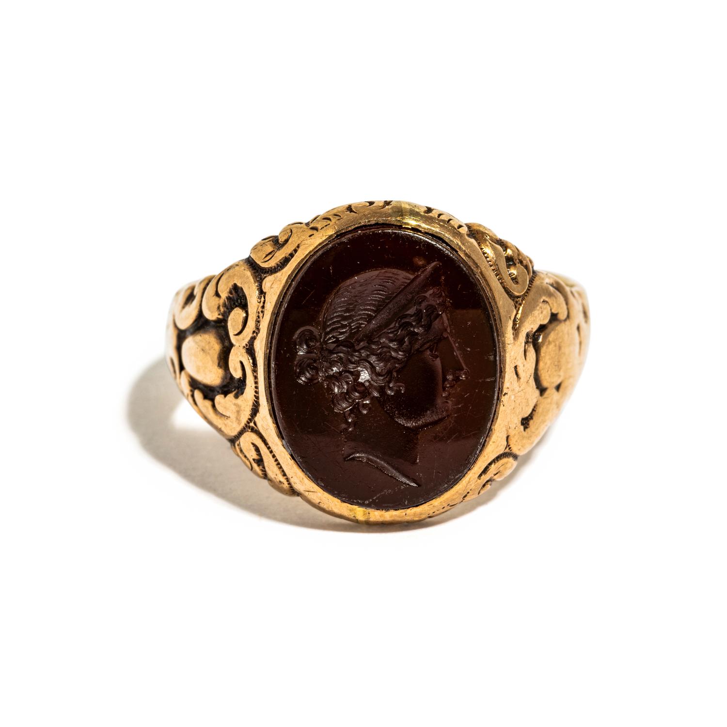 A Neoclassical Gold and Carnelian Finger Ring with the Portrait Head of a Woman