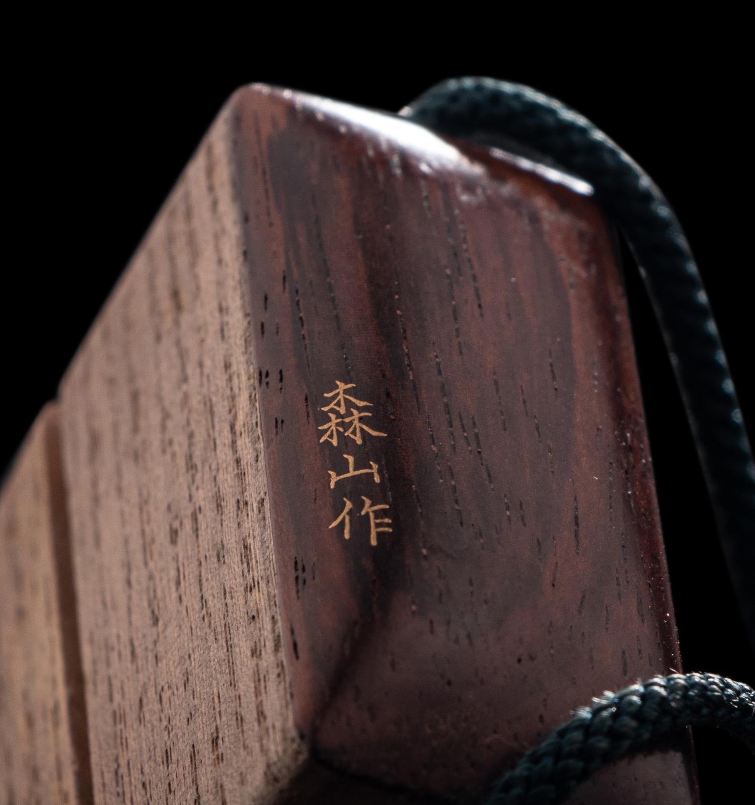 A Japanese Gold Decorated Wood Single-Case Inro