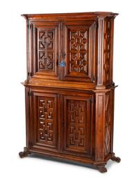 A Continental Walnut Two-Part Cabinet