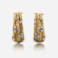 A pair of eighteen karat gold and diamond ear clips