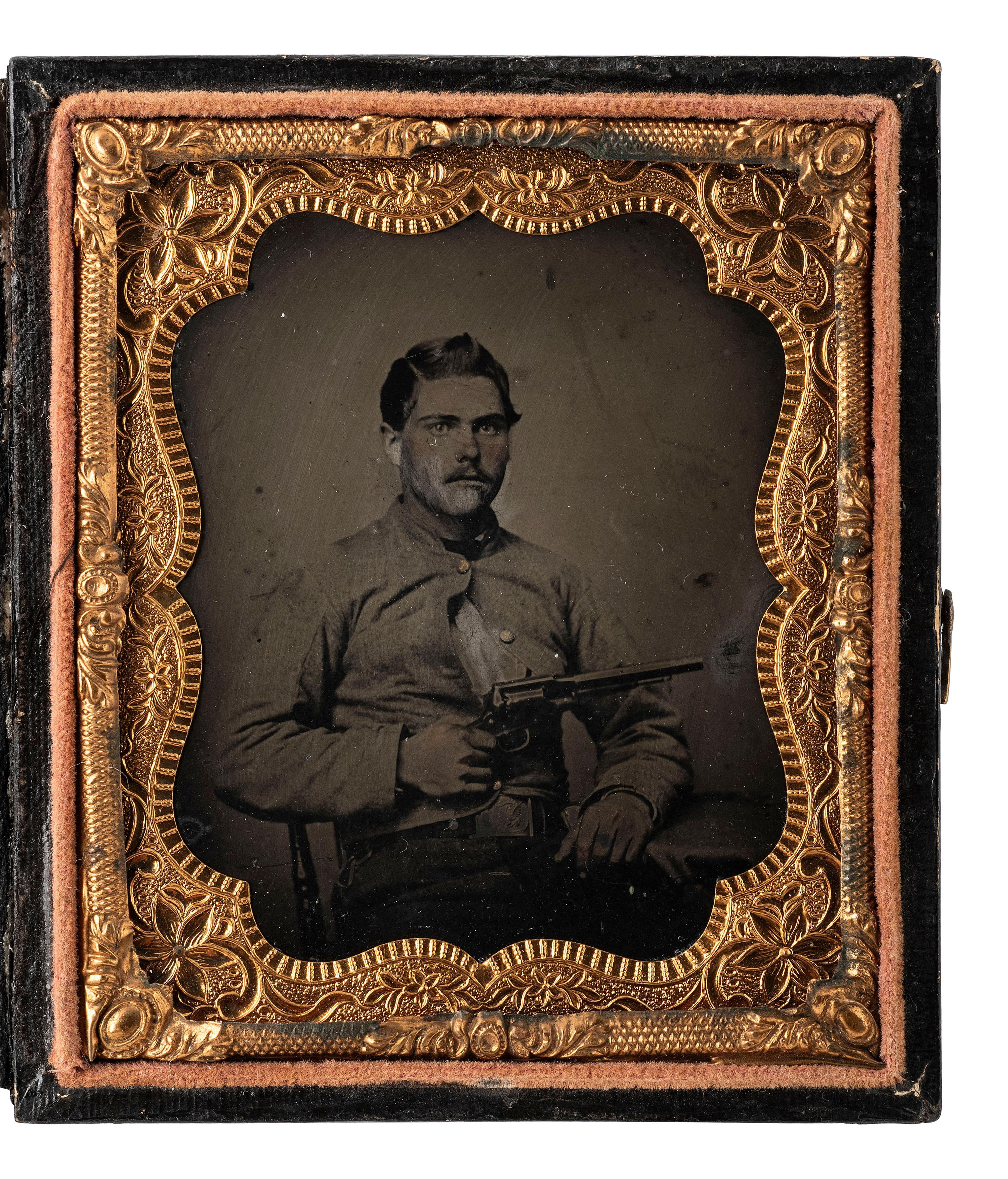 [CIVIL WAR]. Sixth plate tintype of a Confederate cavalryman displaying his Remington revolver.