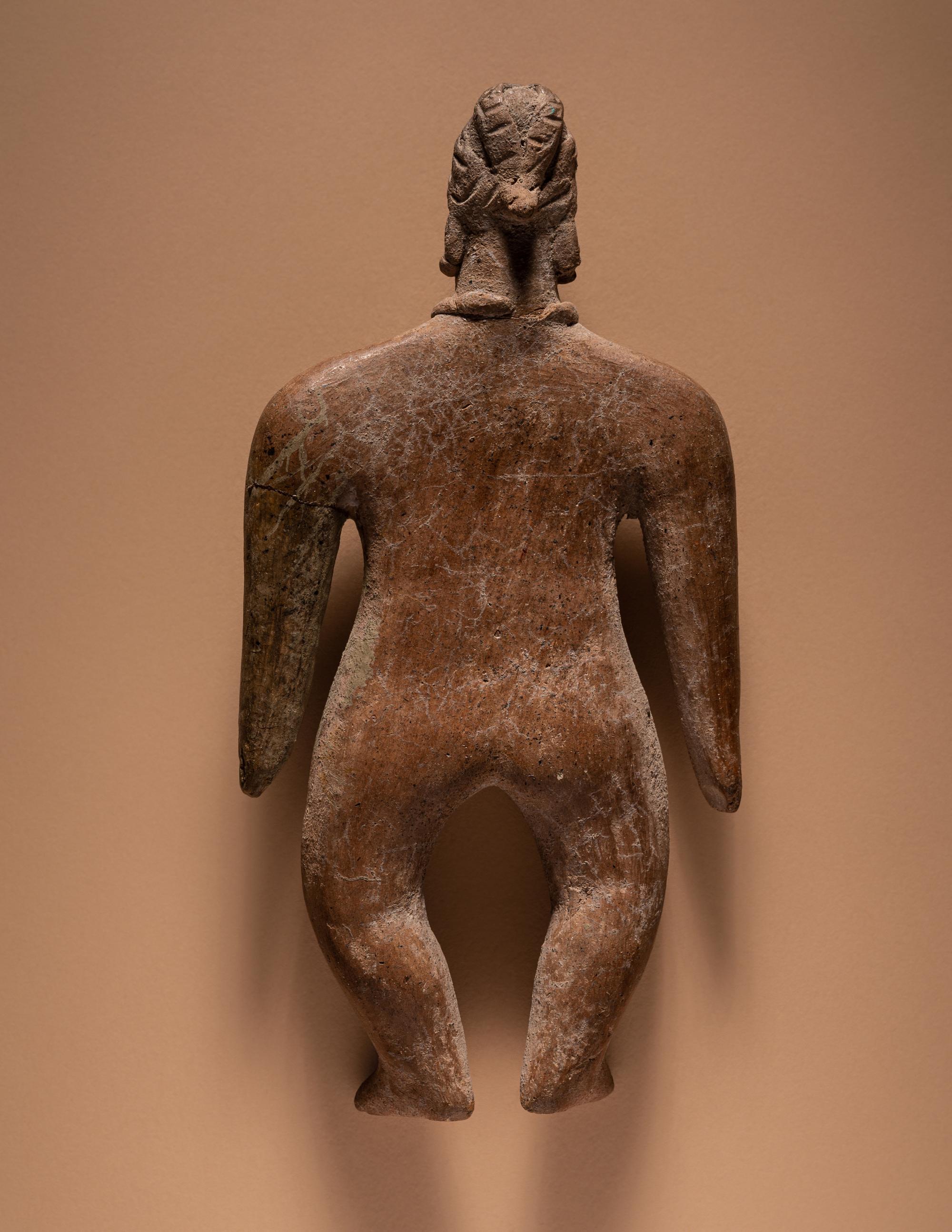 A Colima Standing Female Figure