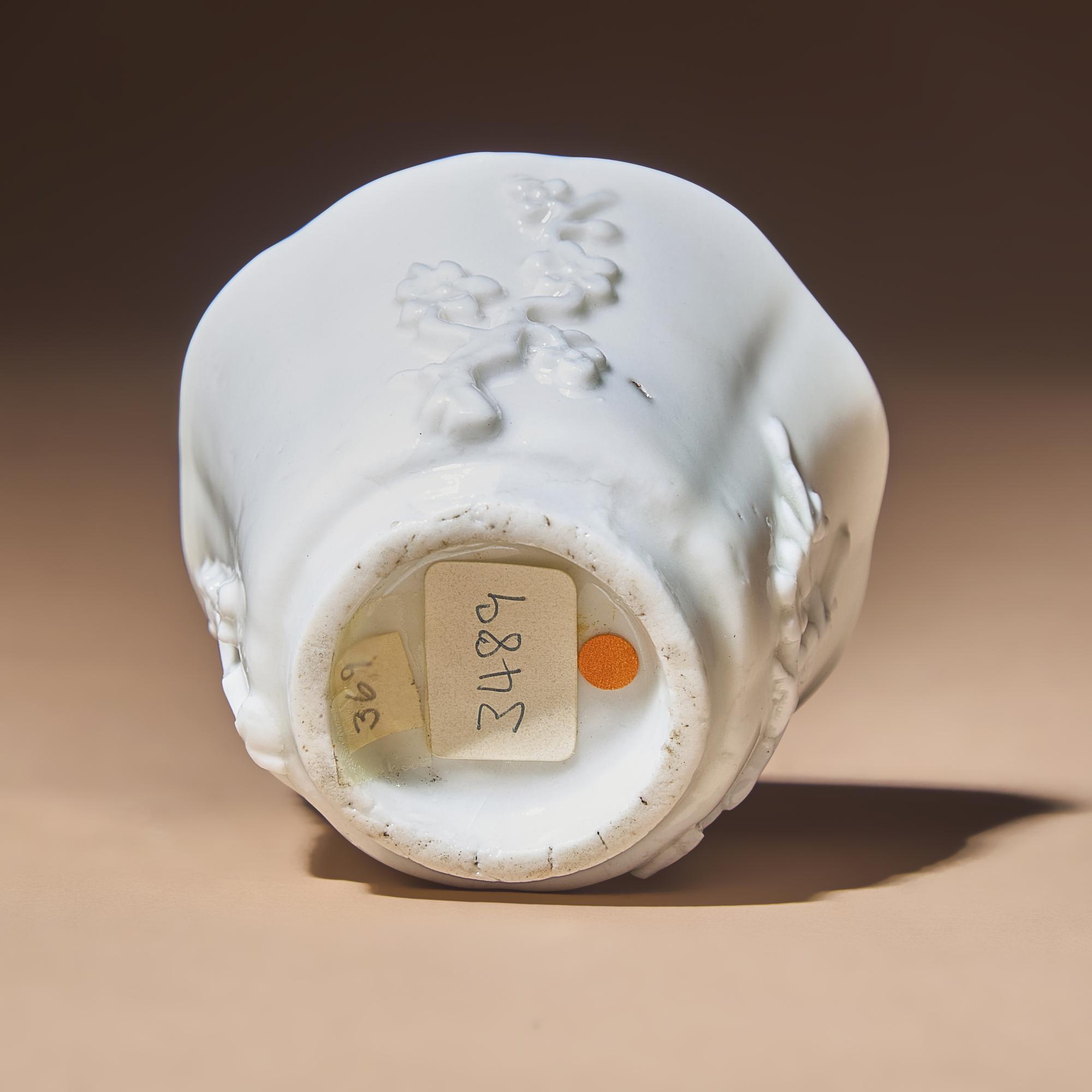 A Chinese Blanc-de-Chine Porcelain Cup, 17th Century — 明末清初 德化白瓷貼塑梅紋花口杯
