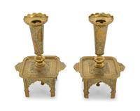 A Pair of Veneto-Saracenic Brass Candlesticks