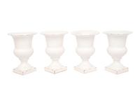 A Set of Four White Glazed Faience Urns