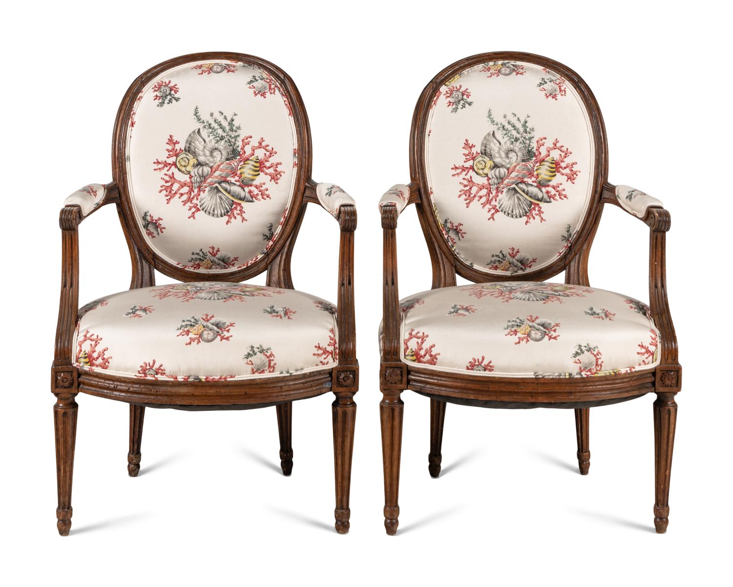 A Pair of Louis XVI Walnut Fauteuils