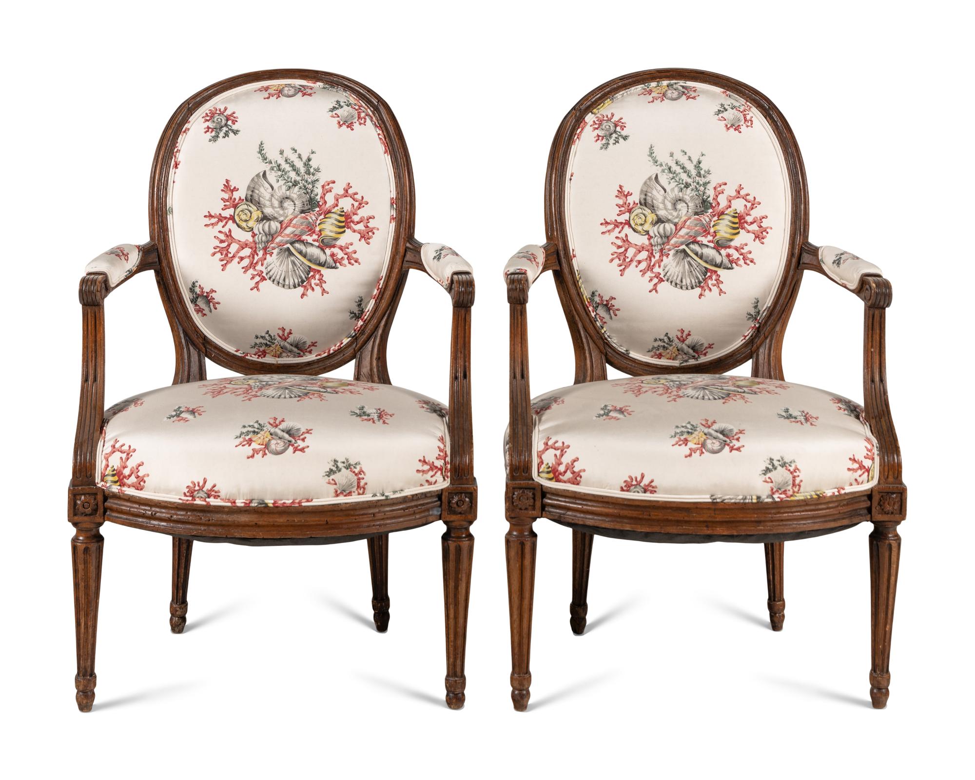 A Pair of Louis XVI Walnut Fauteuils
