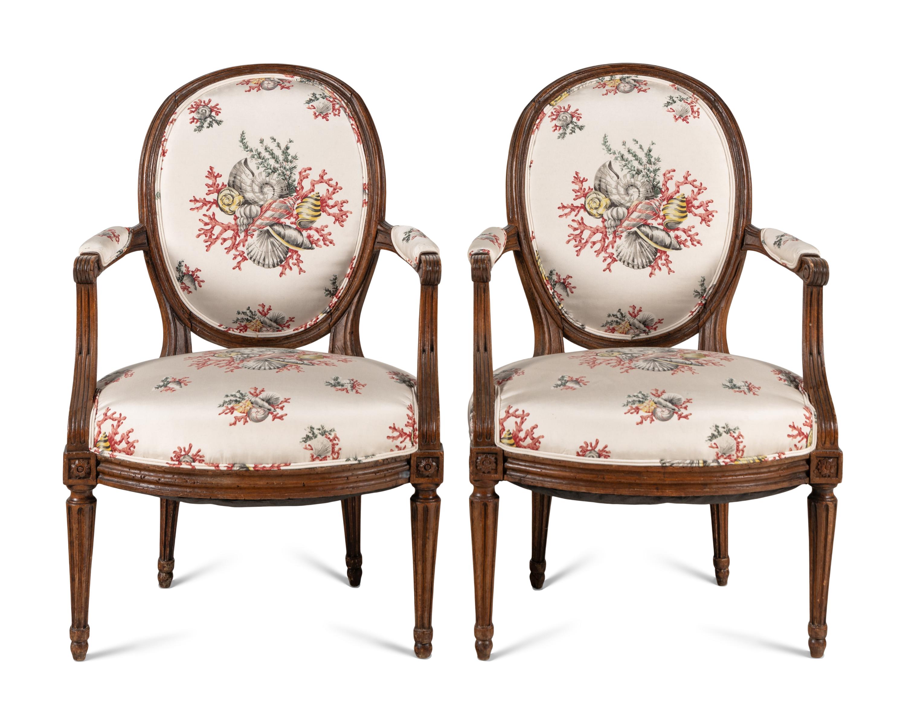 A Pair of Louis XVI Walnut Fauteuils