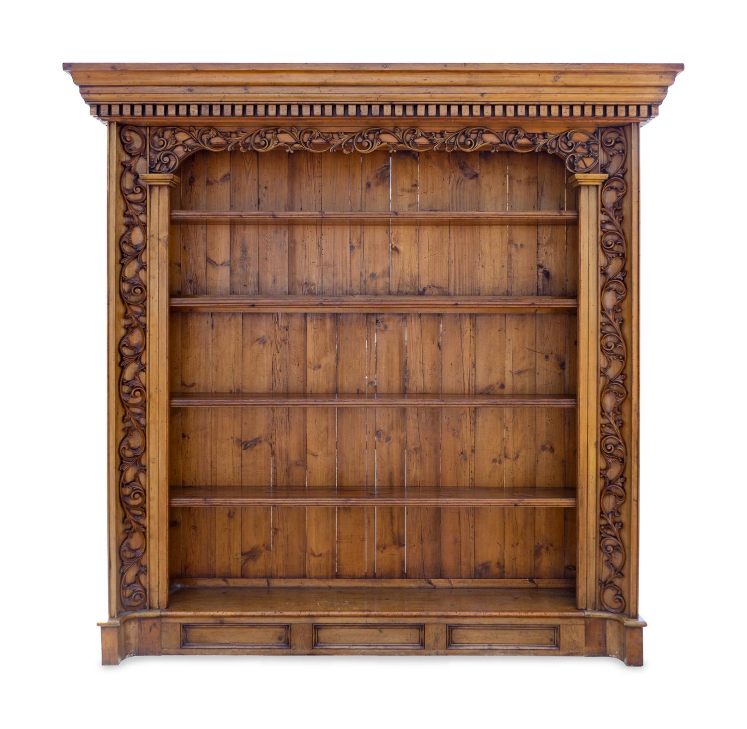 A Pair of Continental Carved Wood Bookcases — 20TH CENTURY