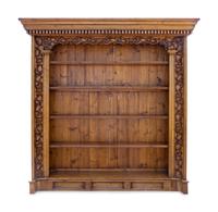 A Pair of Continental Carved Wood Bookcases — 20TH CENTURY