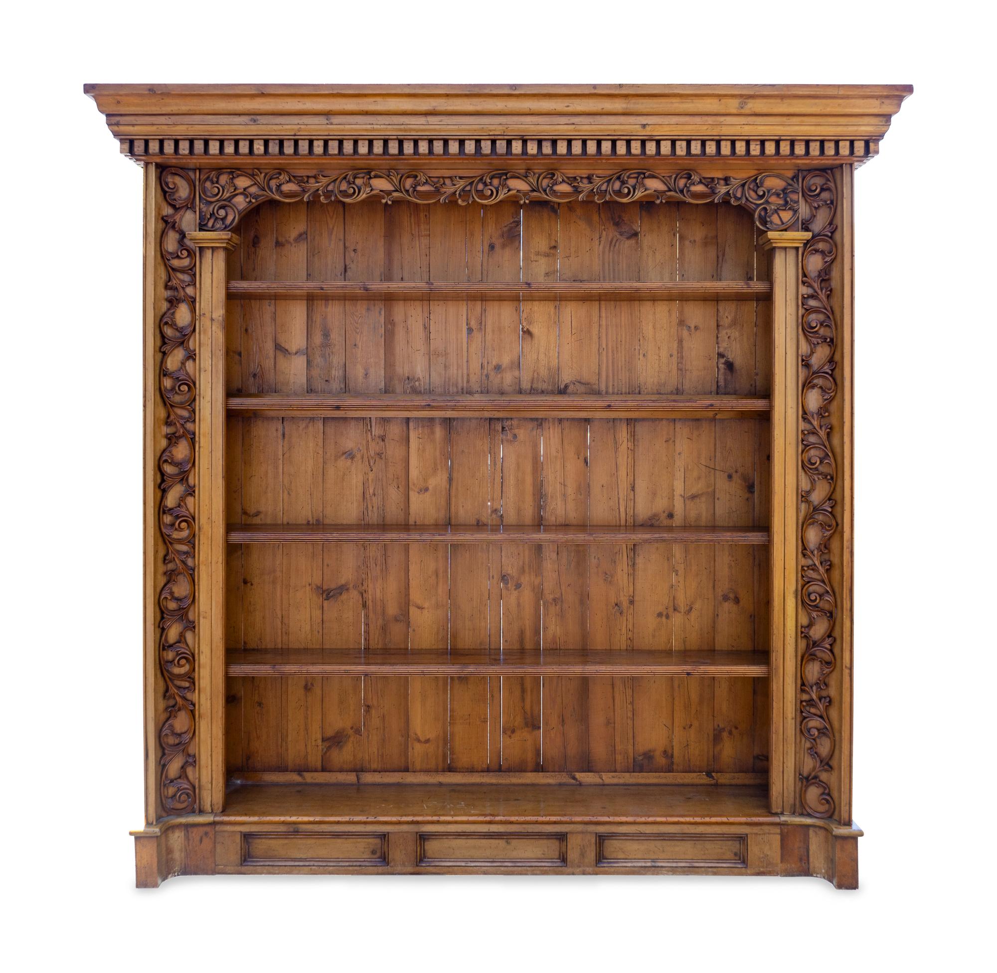 A Pair of Continental Carved Wood Bookcases — 20TH CENTURY