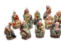 A Set of Eighteen Chinese Export Enameled Porcelain Figures of Immortals