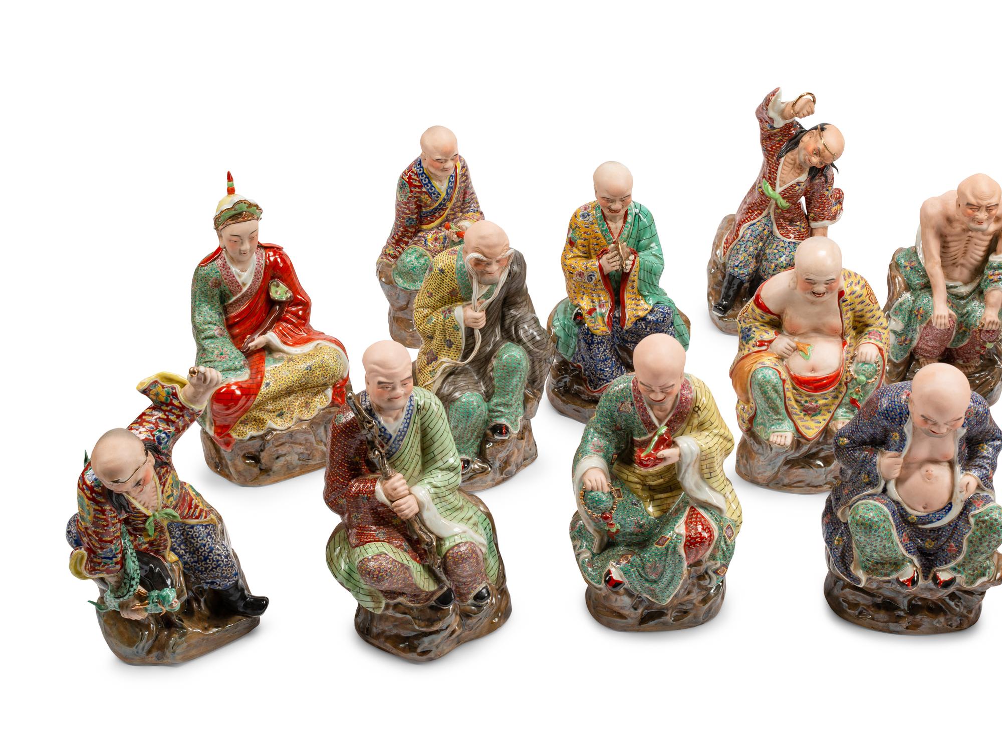 A Set of Eighteen Chinese Export Enameled Porcelain Figures of Immortals