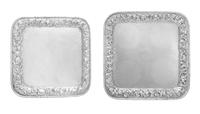 Two American Silver Salvers, Howard & Co., New York, NY, 1881, each of square form, the borders worked with repousse floral and foliate