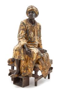 A Continental Cast Metal Figure of a Blackamoor Height 16 1/2 inches. — 19TH CENTURY