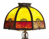 An American Arts & Crafts brass and slag glass table lamp, circa 1920