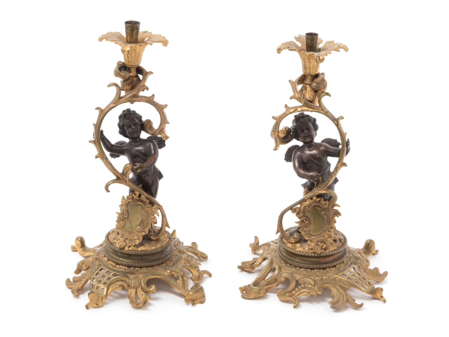 A Pair of Continental Gilt Metal Candlesticks
