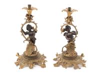 A Pair of Continental Gilt Metal Candlesticks