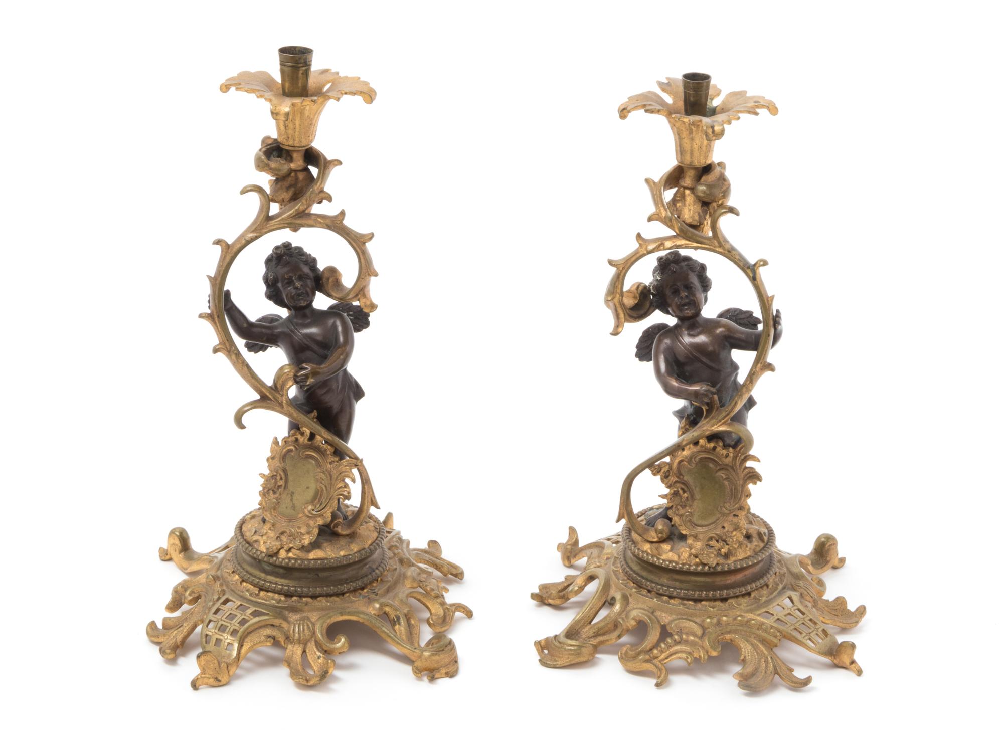 A Pair of Continental Gilt Metal Candlesticks
