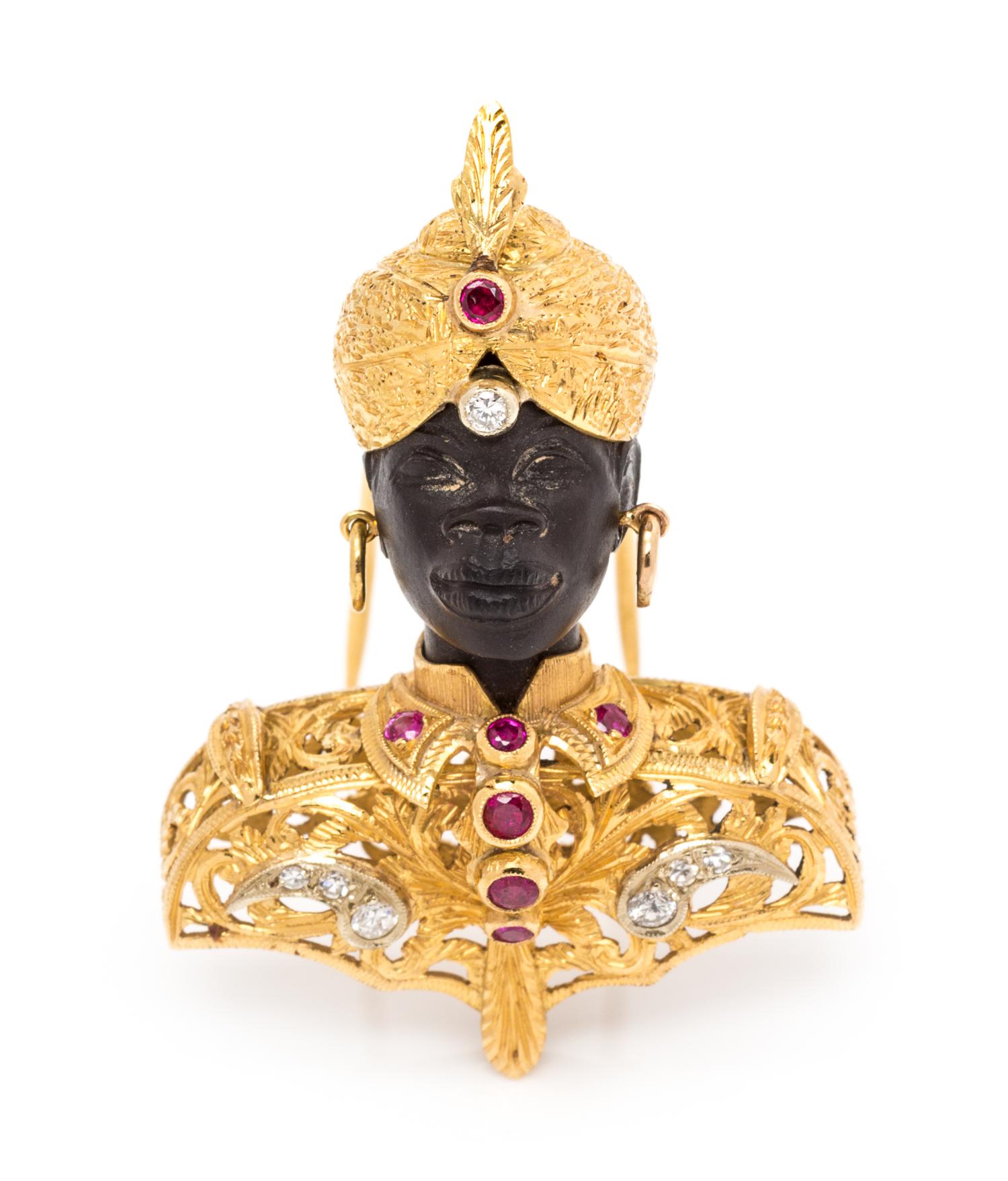 An 18 Karat Bicolor Gold, Diamond and Ruby Blackamoor Brooch, 13.40 dwts.
