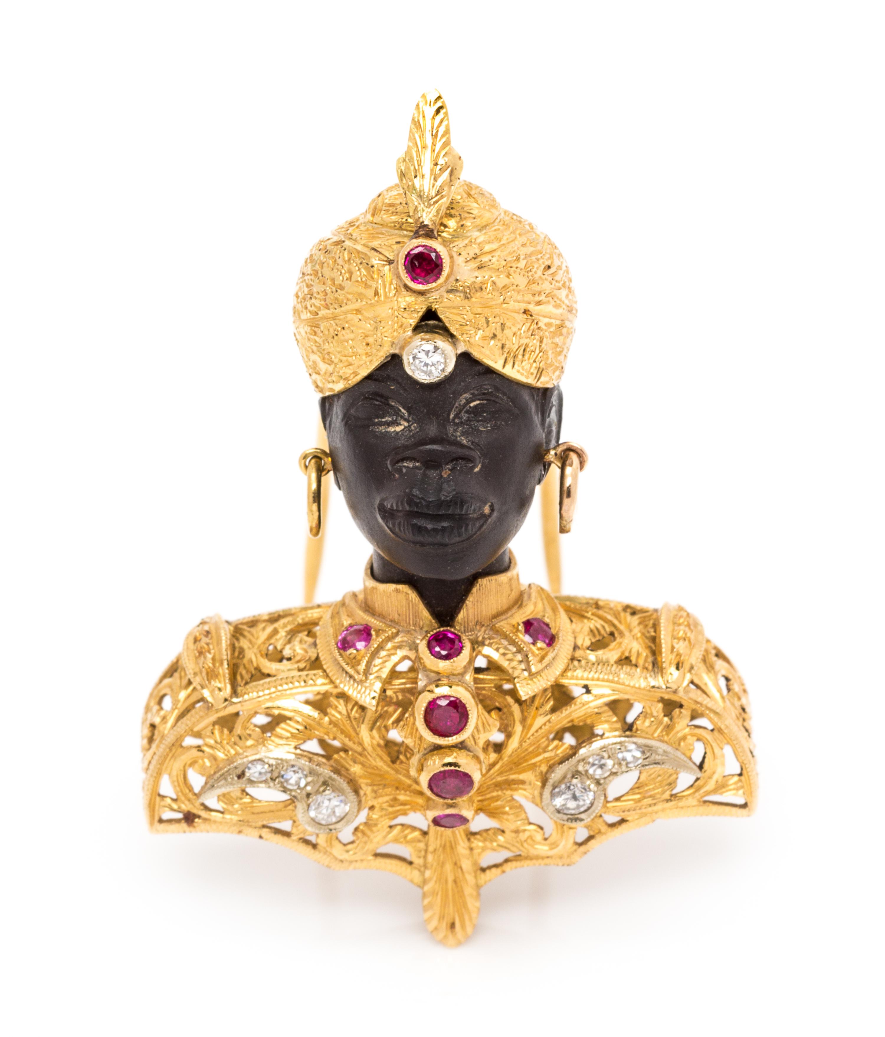 An 18 Karat Bicolor Gold, Diamond and Ruby Blackamoor Brooch, 13.40 dwts.