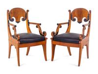 A Pair of Biedermeier Parcel Ebonized Armchairs