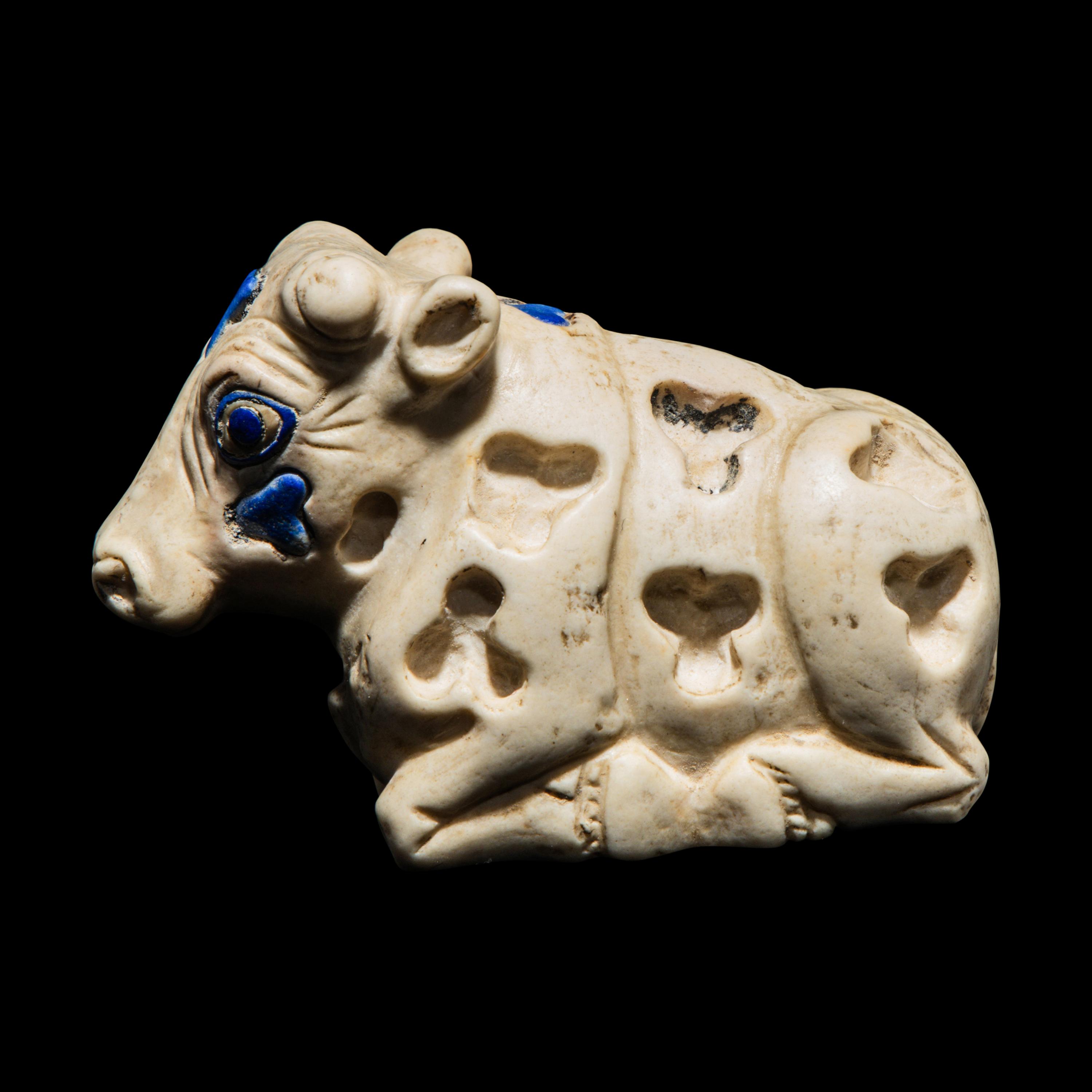 A Mesopotamian Marble and Lapis Lazuli Inlay Recumbent Calf