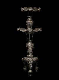 A Large Pair of Bronze Candle Holders